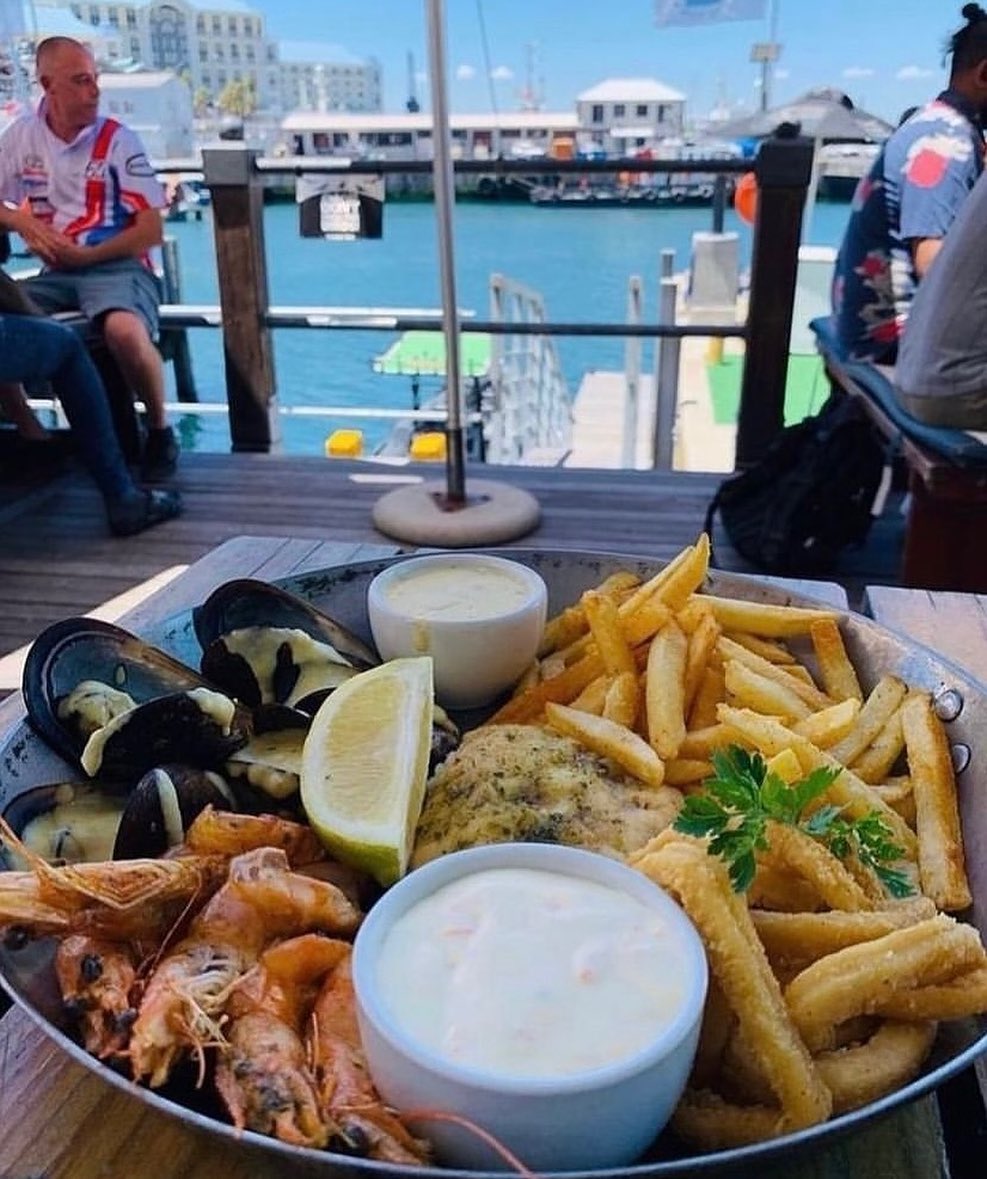 Seafood platter with prawns, mussels, calamari and chips at waterfront