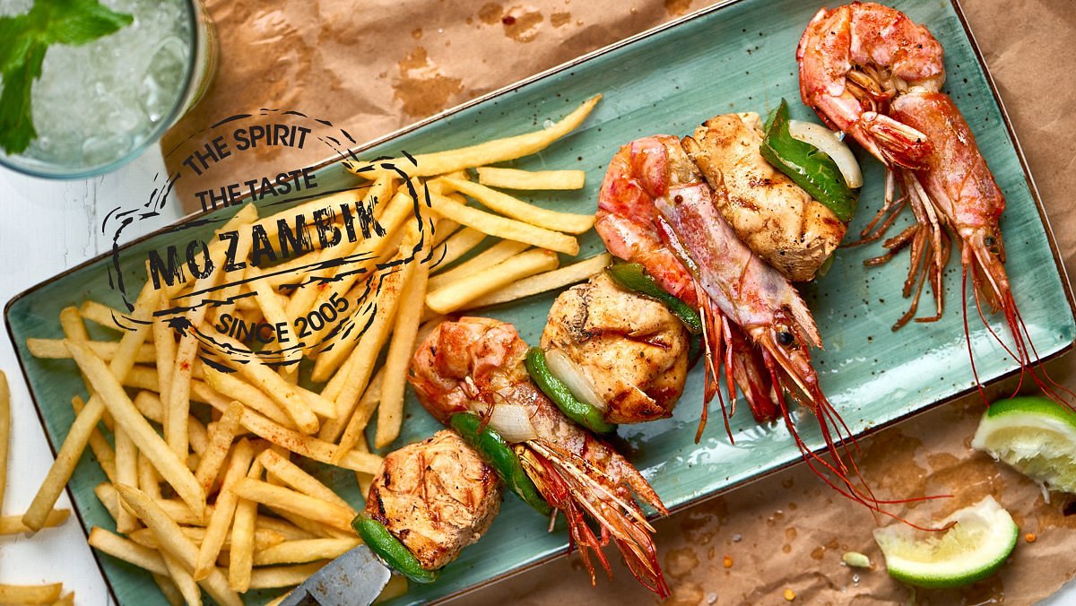 Grilled prawn-and-pepper skewers with fries and Mozambik stamp