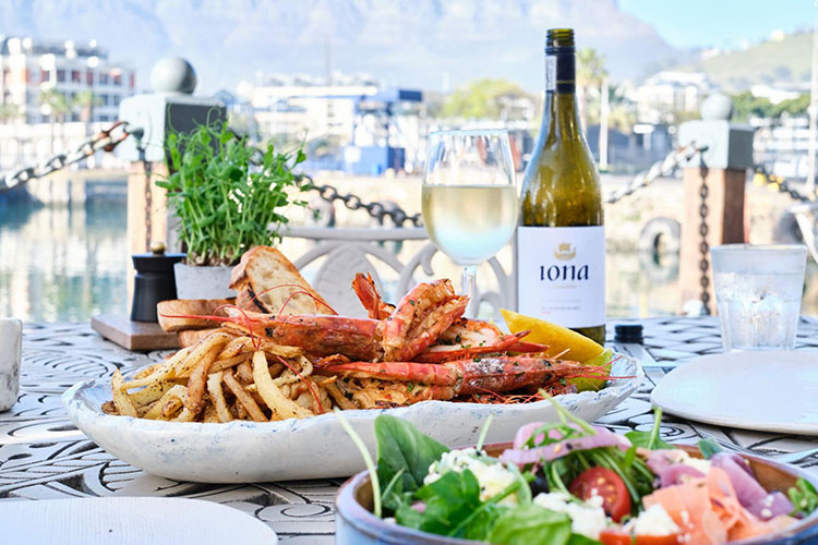Waterfront meal with lobster, fries, salad and Iona wine