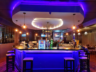 Havana Nights Cuban restaurant interior with illuminated central bar