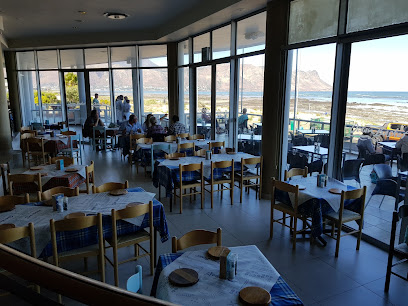 Ocean Basket Strand dining room with ocean view and outdoor terrace
