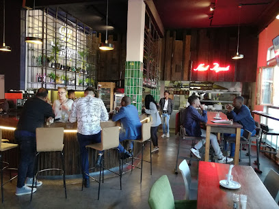 Kind Regards coffee shop interior with patrons at bar and tables