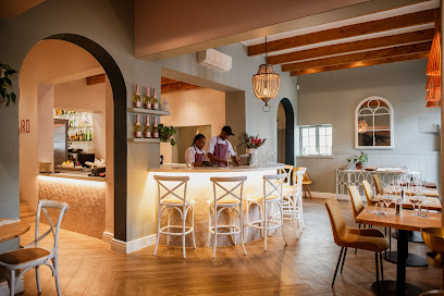 SeaBreeze Fish & Shell dining room with bar and set tables