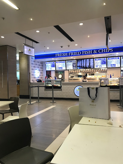 Fishermans Choice takeaway counter with 'Fresh Fried Fish & Chips' sign