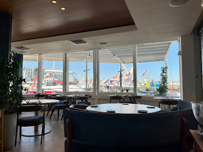 PIER Restaurant dining room with water views of V&A Waterfront harbor