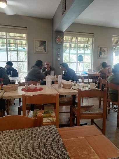 Penny Lane cafe interior with diners at wooden tables and menus
