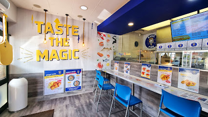 Magic Fish Flamingo Square counter with blue chairs and 'Taste the Magic' wall sign