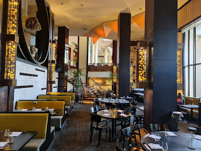 Nobu Cape Town upscale dining room with yellow banquettes