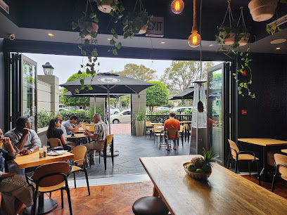 Shift Espresso Bar Green Point open café with indoor tables and outdoor canal-edge seating