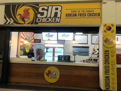 Sir Chicken counter with yellow 'Home of the Famous Korean Fried Chicken' sign