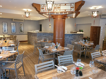 Tai Ping Chinese Restaurant dining room with set tables and takeaway counter