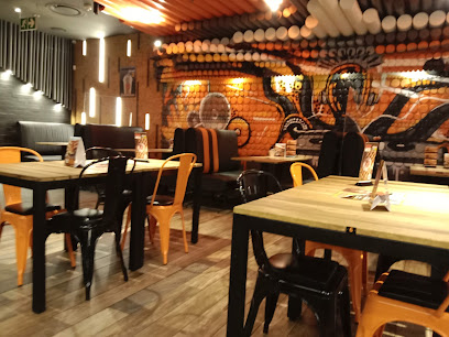 RocoMamas Westgate interior with mural, black and yellow seating