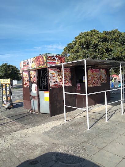 Kasi Grillers roadside kiosk with menu posters and serving counter