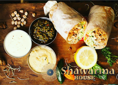 Shawarma House Grassy Park chicken shawarma wrap, dips and lemon