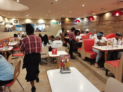 Wimpy N1 City busy dining room with staff serving seated customers