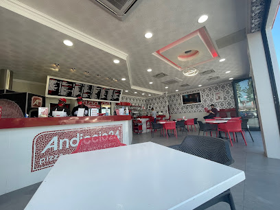 Andiccio24 Sunset Beach interior with service counter, overhead menu boards and red seating