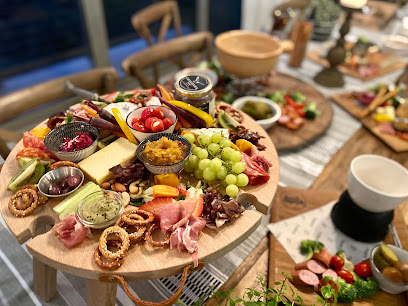 Furny's Fine Wines tasting-room charcuterie board with cheeses and grapes