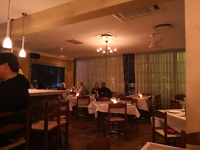 Piccolo Posticino Hout Bay dining room with candlelit tables and relaxed diners