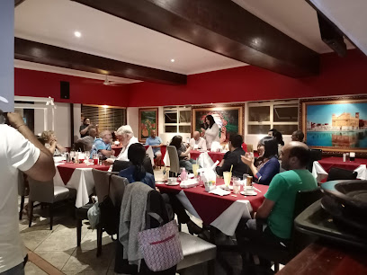 Tadka Indian Cuisine Rondebosch dining room with guests at red-clothed tables