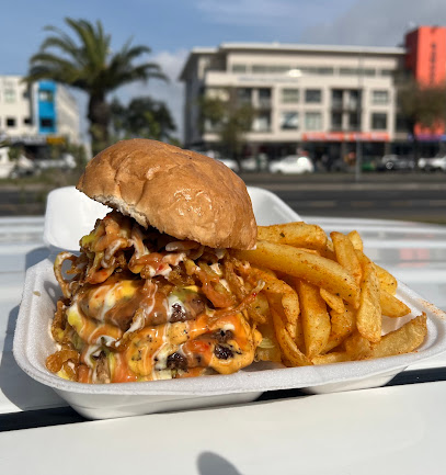 Big Fellas Grill stacked cheeseburger with sauce and seasoned fries