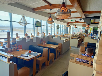 Soaring Hawk Spur spacious booth dining area with large windows