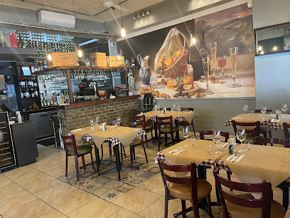La Boheme Wine Bar & Bistro interior with set tables and wine mural