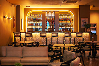 Ariel Modern Italian bar and lounge with illuminated back bar and seating