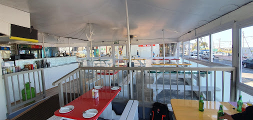 Beira Mar Portuguese Restaurant casual coastal dining area with red tables