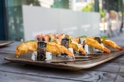 Aiko Plus tempura prawn nigiri on a rectangular ceramic platter