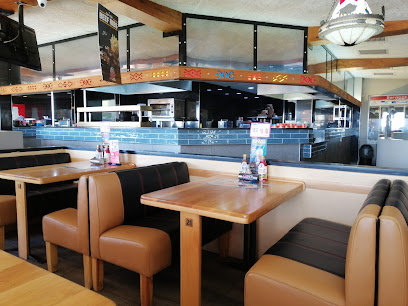 Eagle Eye Spur Halaal dining area with booths and open kitchen