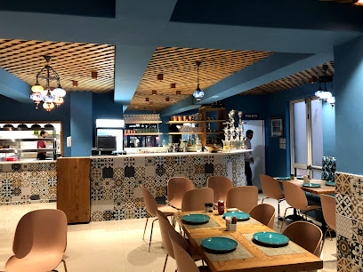 Saray Turkish Restaurant dining area with patterned tile bar and set tables