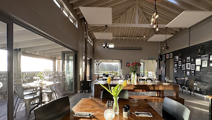 Sopra Italian Restaurant dining room with wooden tables, tulips, and terrace view