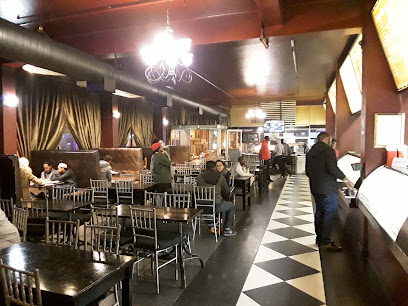 Food Inn India Long Street dining room with patrons and service counter