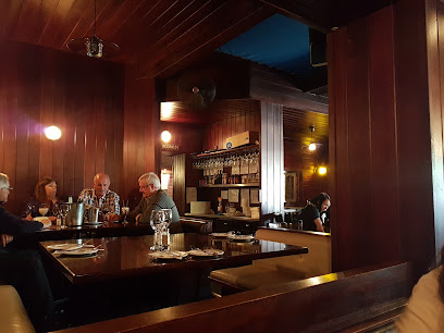 Pirates Steakhouse & Pub wood-paneled bar with diners and drinks