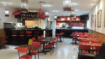 Hong Japanese Restaurant interior with red chairs, tables and sushi counter