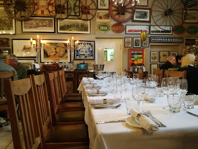Quentin at Oakhurst dining room with long white‑clothed table set for wine service
