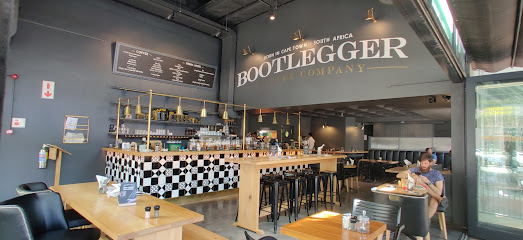 Bootlegger Claremont café interior with checkered counter, bar stools, wooden tables