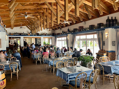 Seaforth Restaurant dining room with wooden beams and busy blue-striped tables