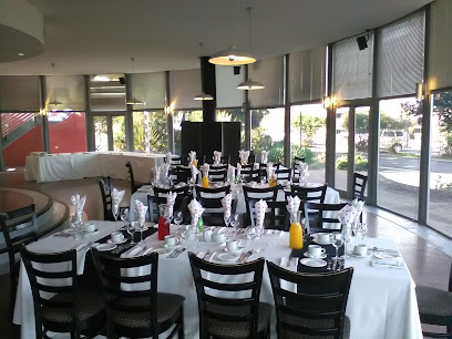 Encore Restaurant conference dining room with banquet tables set for a meal