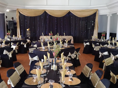 Decksters Catering banquet setup with black-and-gold linens and place settings