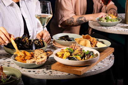 Judd's Local table with shared South African small plates and wine