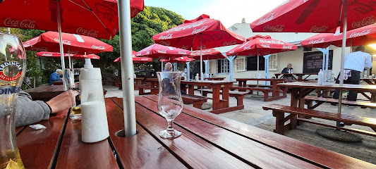 Fisherman's Garden outdoor picnic seating with red Coca-Cola umbrellas