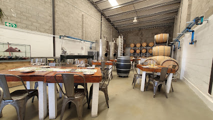 My Couzens Family Restaurant dining area with wooden tables and barrels