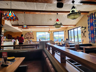 Red Hawk Spur Plumstead interior with booths, hanging stained-glass lamps and diners