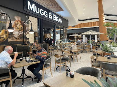 Mugg & Bean Table Bay Mall café interior with seating and diners