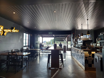 Bootlegger Strand cafe interior with coffee bar, seating and open front