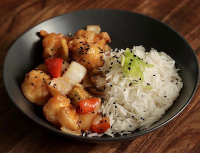 Kom Chow bowl: white rice with black sesame and saucy fried morsels