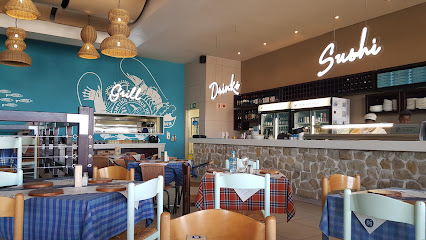 Ocean Basket Plattekloof Village interior with sushi counter, grill mural and checkered-tablecloth tables
