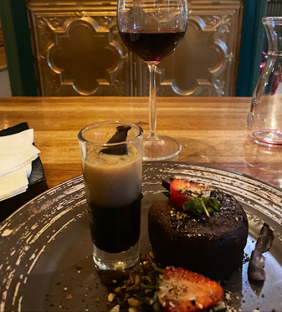 B74 chocolate fondant with strawberry, pistachios, cream shooter and red wine