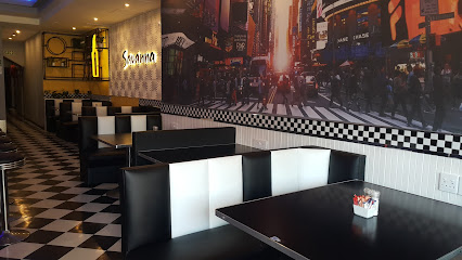 Bandits & Burgers Sea Point diner booths with checkerboard floor and wall mural
